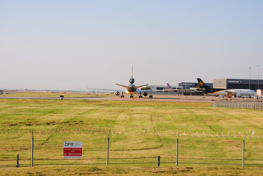 Luxury private jet parked on a runway under a clear sky.