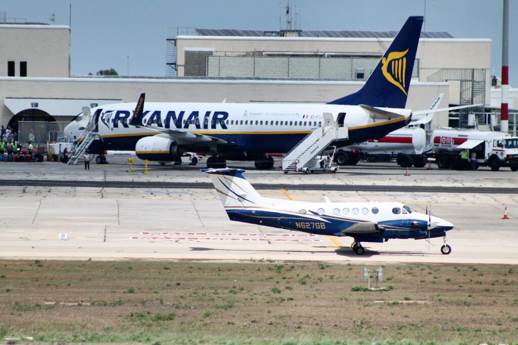 A sleek private jet parked on a runway.