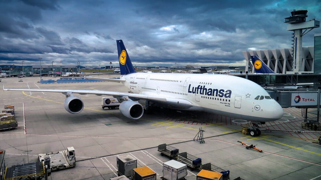 Commercial airplane parked at the airport terminal.