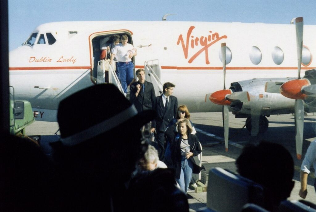 Passengers disembarking from an airplane.