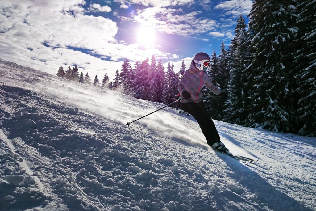 A man gracefully gliding on ice while skiing.