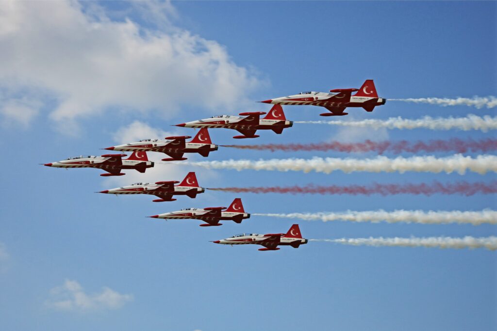 Fleet of private jets soaring gracefully in the sky.