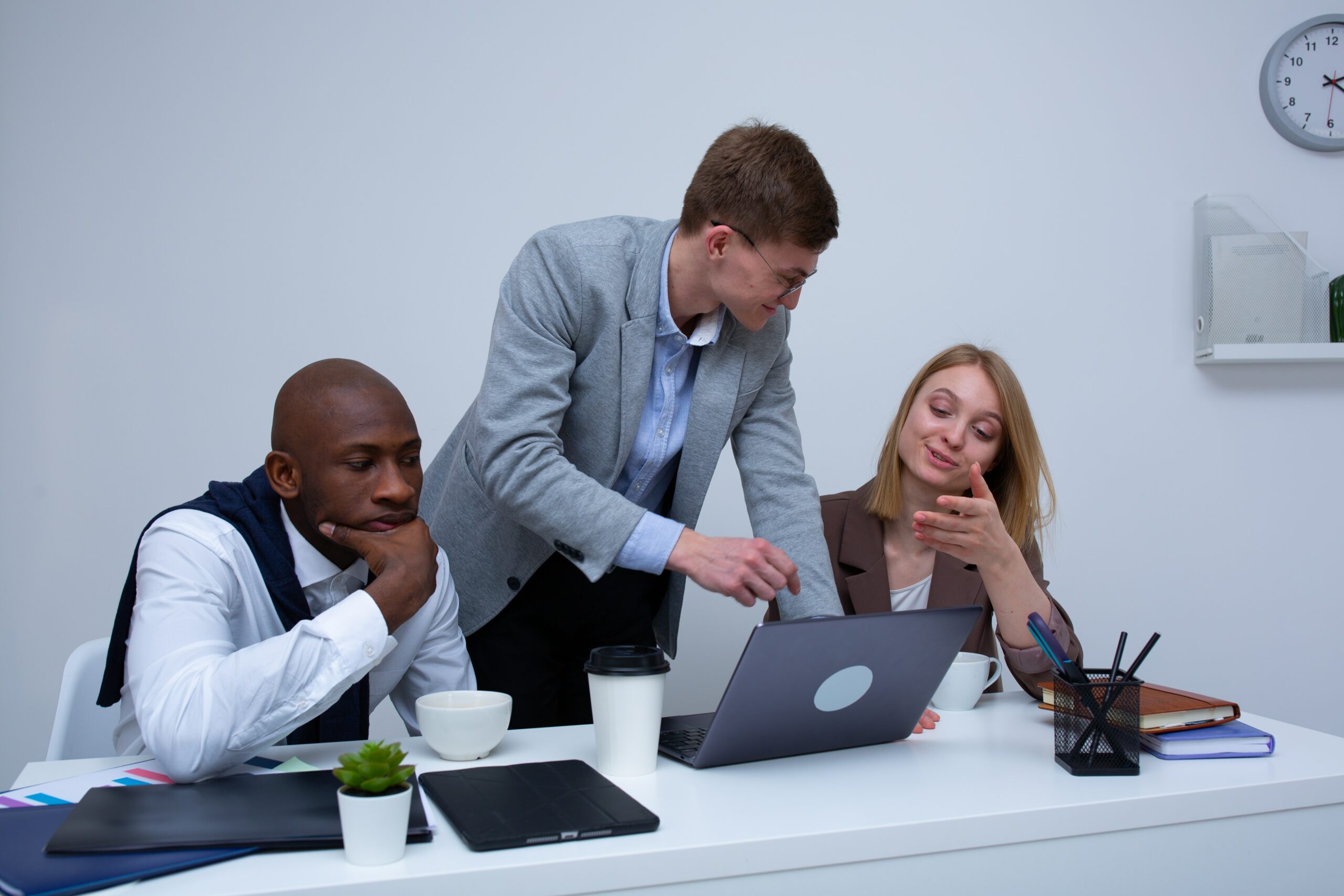 Employees discussing plans for their upcoming New Year break in a collaborative workspace.