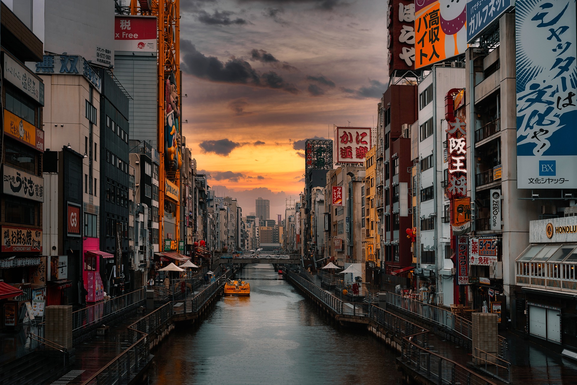 Scenic panorama of Osaka, Japan, featuring a serene river gracefully winding through the cityscape.