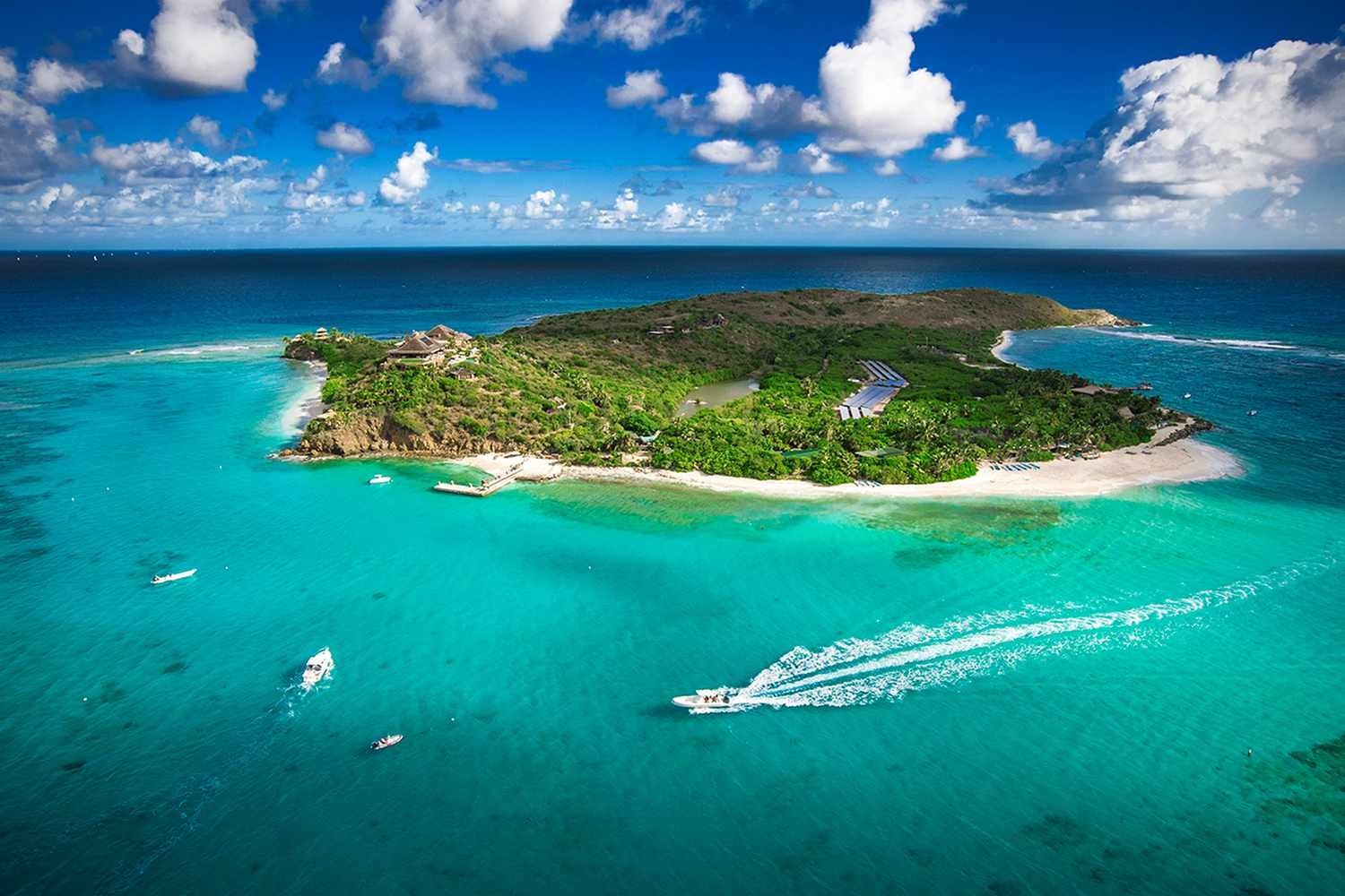 Aerial view of Necker Island, showcasing the pristine beaches and lush tropical landscape of the Virgin Resort.