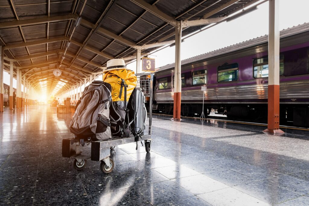 Suitcases waiting on the platform, ready to be loaded onto a train.